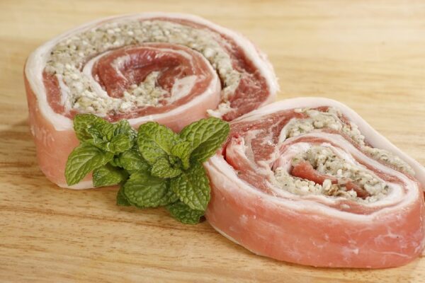 Two,Slices,Of,Uncooked,Lamb,Breast,Rolled,And,Stuffed,With