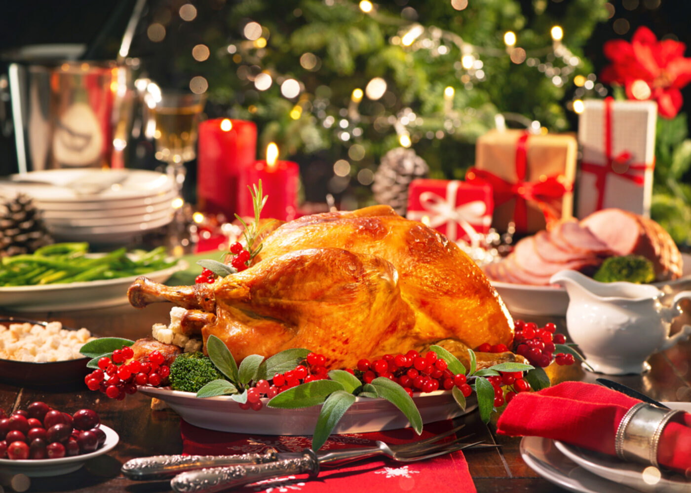 Christmas,turkey,dinner.,baked,turkey,garnished,with,red,berries,and